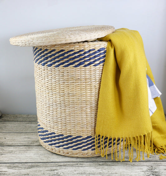 Handwoven round laundry hamper with blue strips