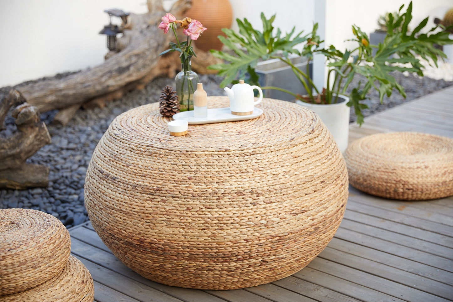 Round wood coffee table covered with straw