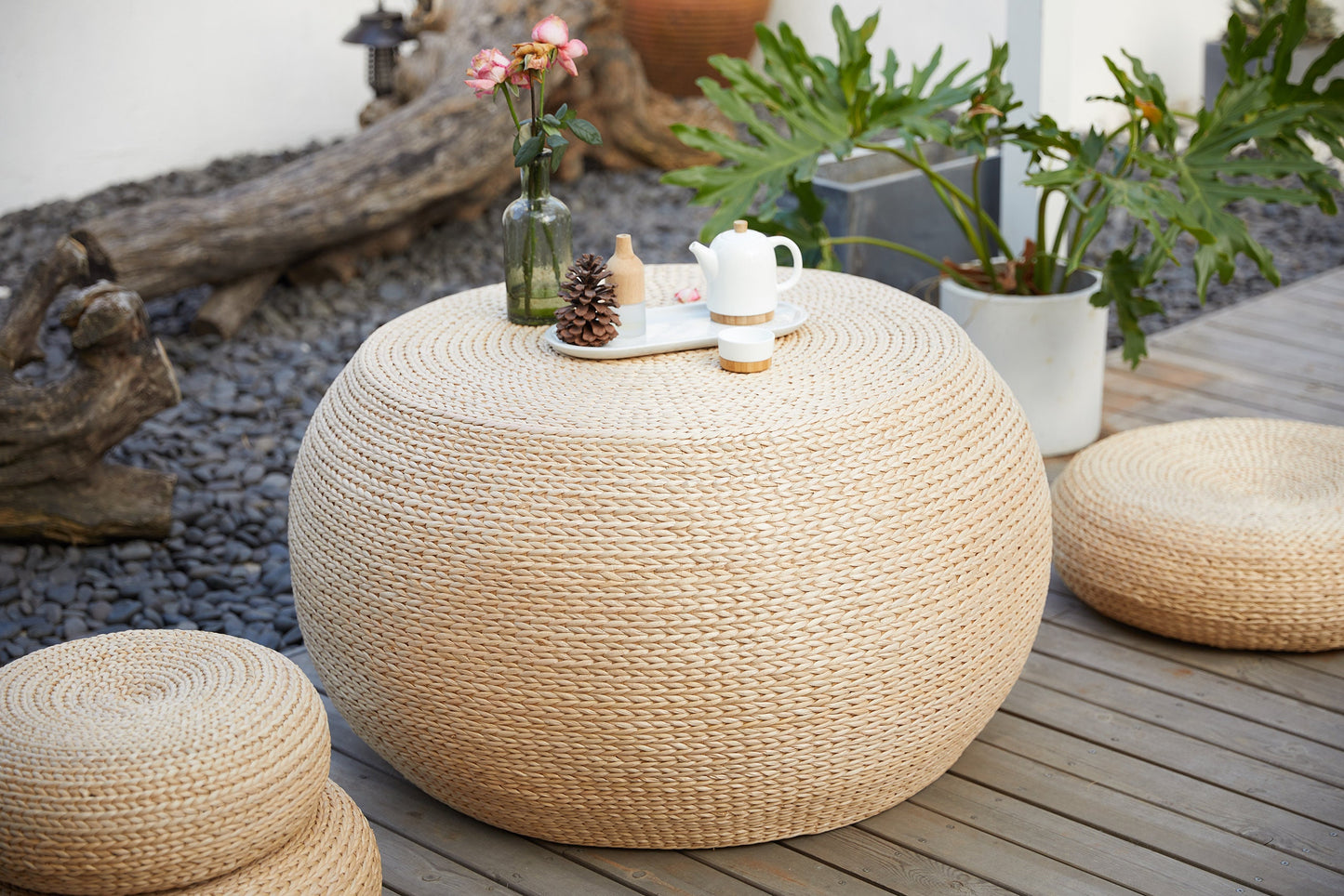 Round wood coffee table covered with straw