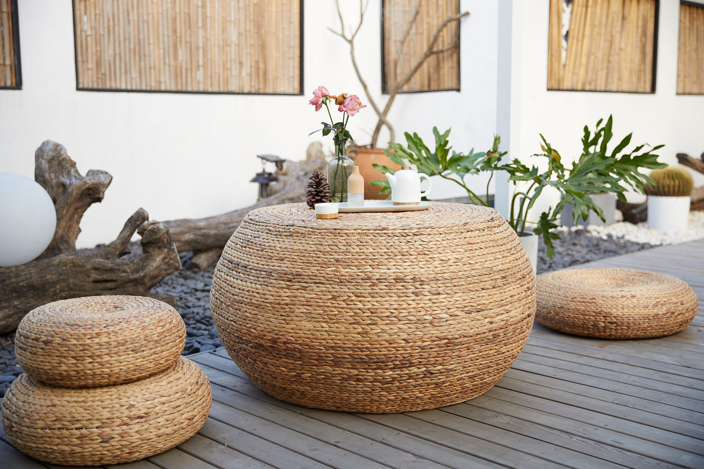 Round wood coffee table covered with straw