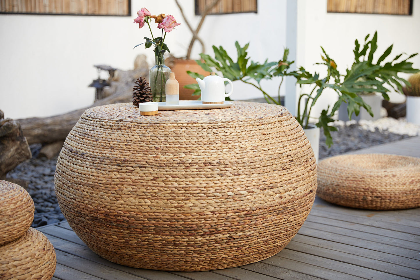 Round wood coffee table covered with straw