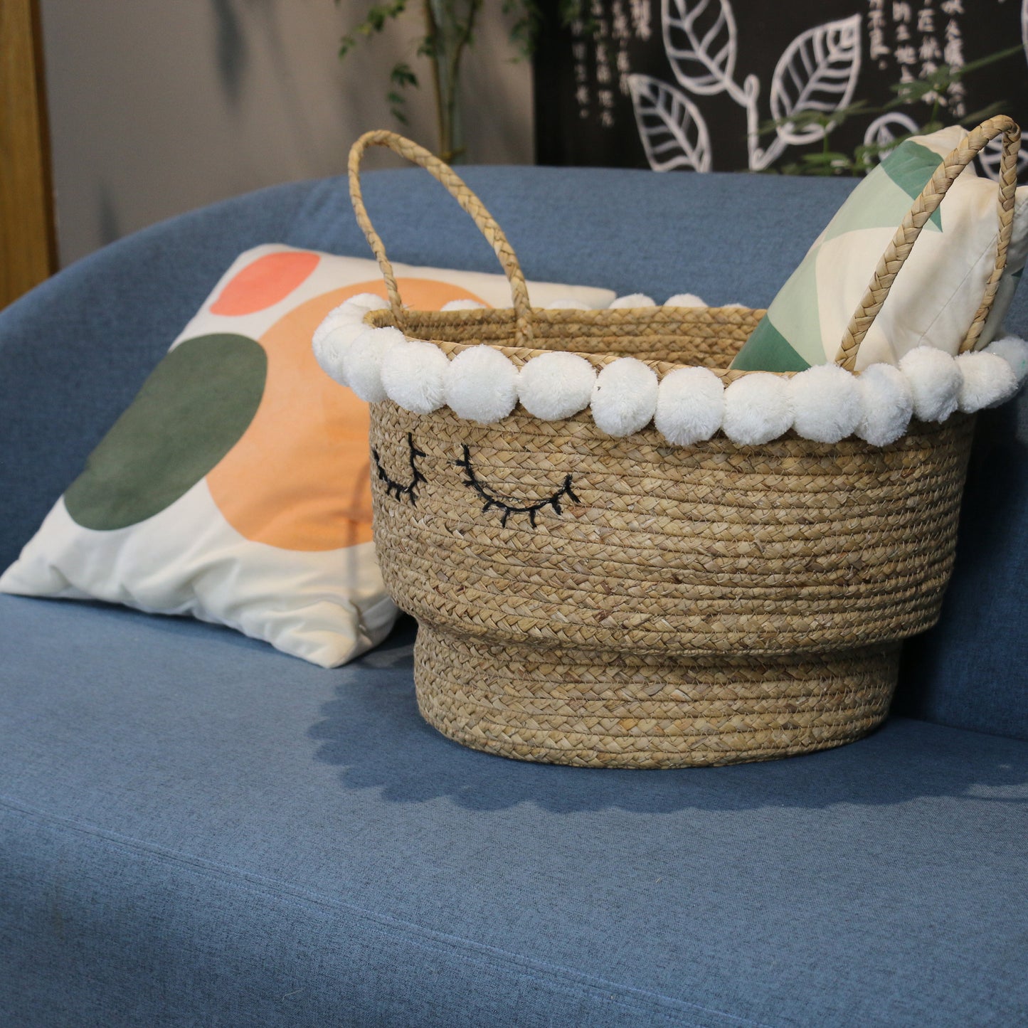 Cute water hyacinth storage baskets with sleep eyes and pom pom trim