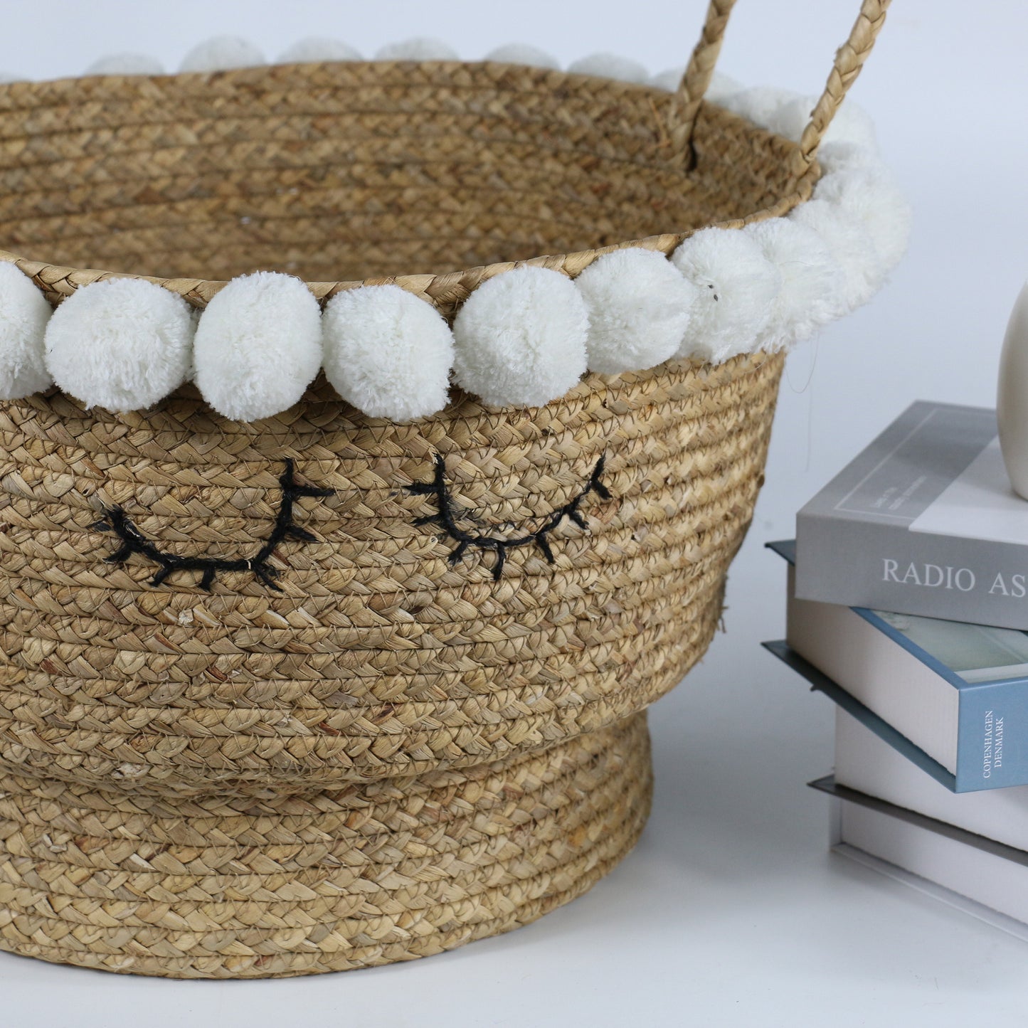 Cute water hyacinth storage baskets with sleep eyes and pom pom trim