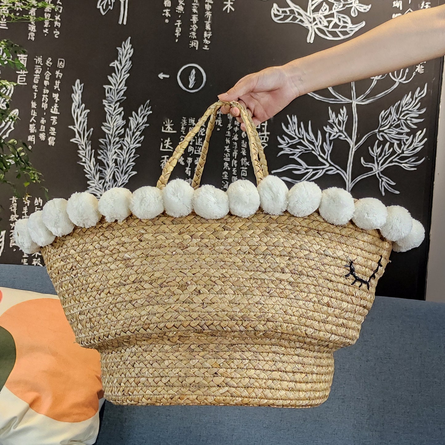 Cute water hyacinth storage baskets with sleep eyes and pom pom trim