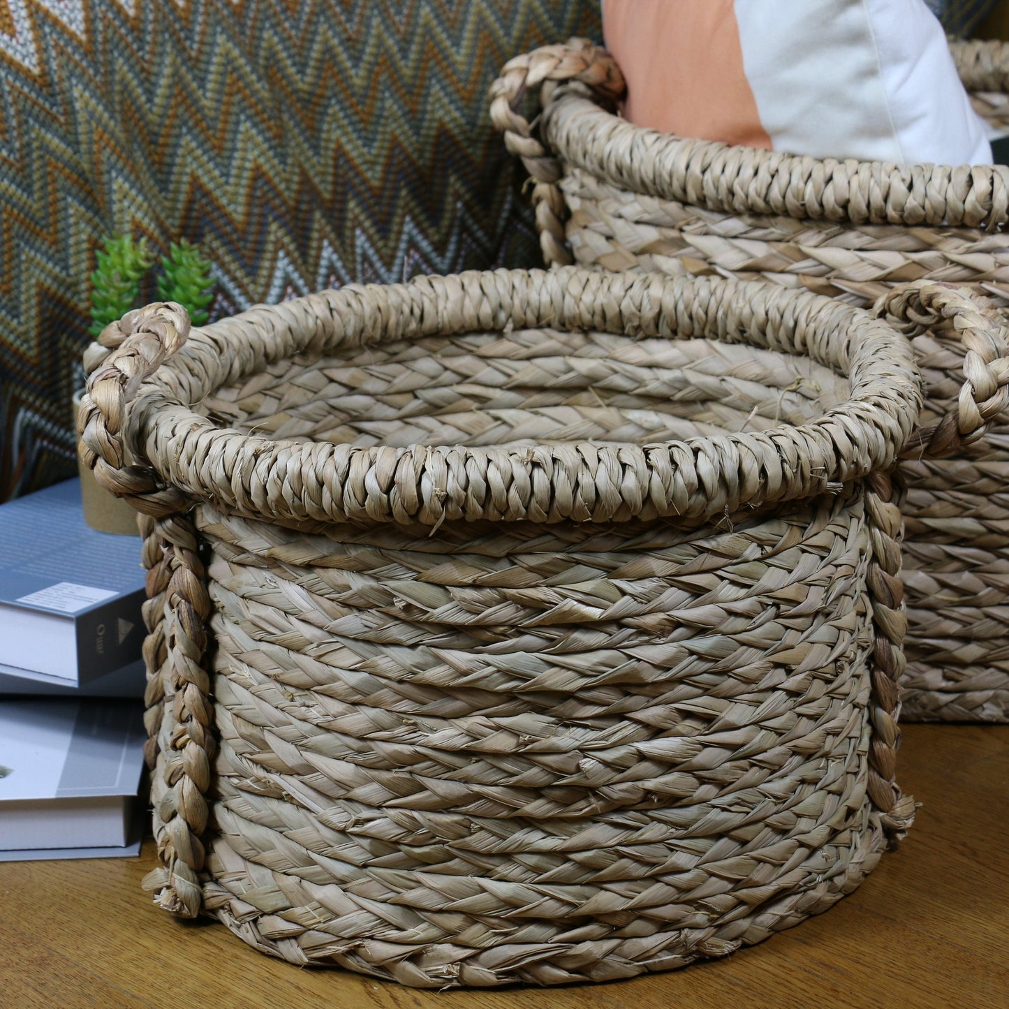 Large round straw baskets with two strong handles