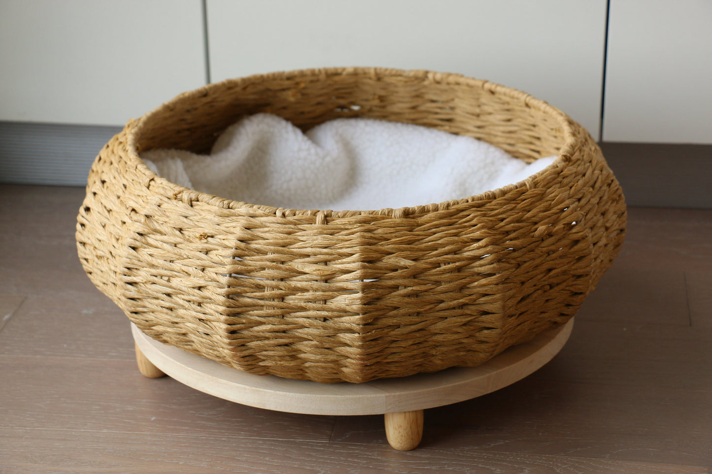 Rustic round cat bed with wood base